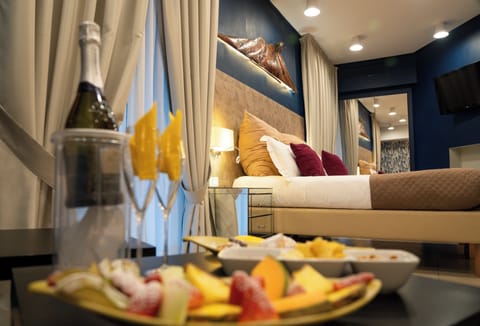 Junior Suite, Multiple Beds | Premium bedding, in-room safe, individually decorated, desk