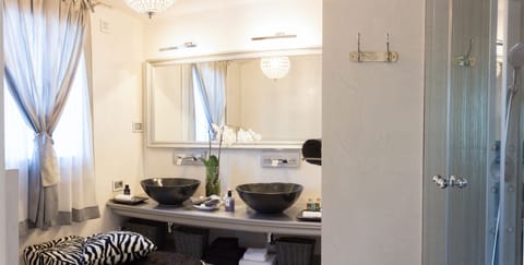 Suite, Balcony, Pool View | Bathroom | Shower, hydromassage showerhead, free toiletries, hair dryer