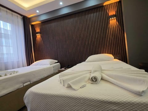 Standard Twin Room, 2 Twin Beds | Minibar, in-room safe, desk, iron/ironing board