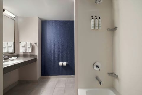 Combined shower/tub, designer toiletries, hair dryer, towels