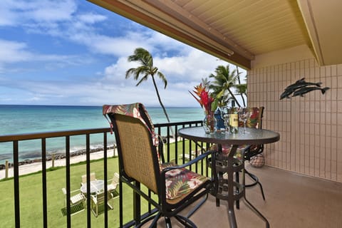 Peaceful balcony retreat with set table and stunning horizon—perfect for morning coffee or evening wine