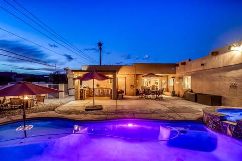 Breathtaking backyard oasis w/relaxing lighted pool/spa, outdoor kitchen,firepit