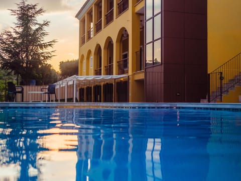 Seasonal outdoor pool, open 10:00 AM to 8:00 PM, sun loungers