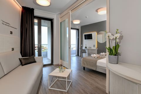 Family Suite, Balcony, Partial Lake View | In-room safe, desk, laptop workspace, soundproofing