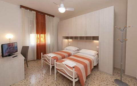 Economy Double or Twin Room | Desk, blackout drapes, iron/ironing board, cribs/infant beds