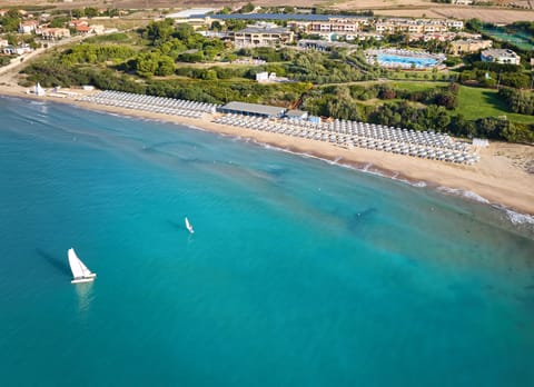 Private beach, sun loungers, beach umbrellas, windsurfing