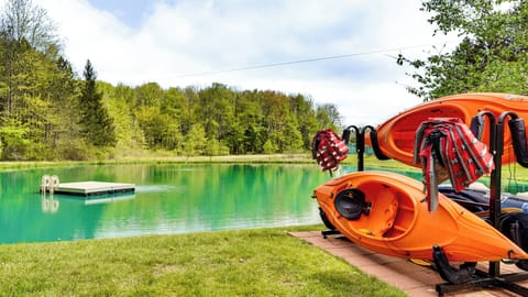 Clear, spring-fed pond with kayaks and a floating dock, ideal for swimming, paddling, fishing, or relaxing by the water. Enjoy peaceful pond views, nature sounds, and a private outdoor escape perfect for unwinding and reconnecting outdoors.