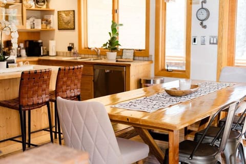 This kitchen marries country aesthetics with modern design elements, creating a warm and inviting space that's both functional and stylish.