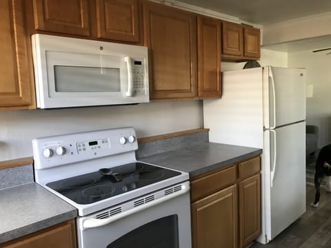 Kitchen has newer cabinets and appliances 