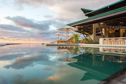 Outdoor pool, open 7:00 AM to 7:00 PM, pool umbrellas, sun loungers