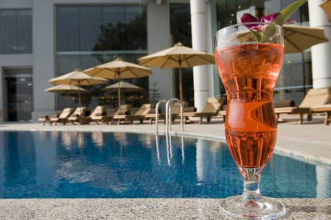 Outdoor pool, open 6:00 AM to 10:00 PM, pool umbrellas, sun loungers