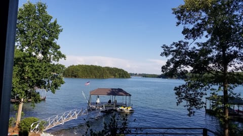 Oversized covered boat dock provides gorgeous views and plenty of shade