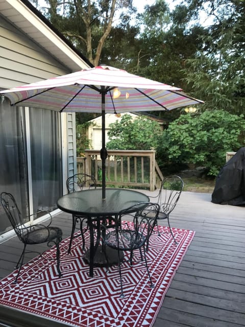 Cozy outdoor patio with gas & charcoal grills for relaxing and entertaining 