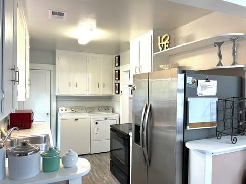 All new kitchen with laundry facilities and stocked pantry. 
