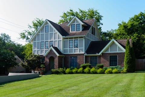 Spacious and level front yard. The street has a sidewalk and bike path.