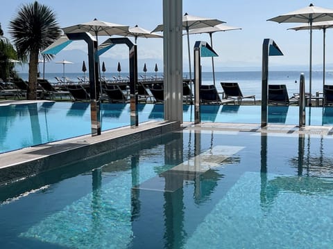 Indoor pool, outdoor pool, pool umbrellas, sun loungers