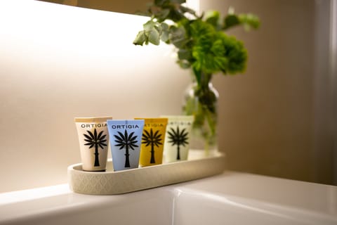 Shower, rainfall showerhead, designer toiletries, hair dryer