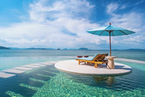 Outdoor pool, open 7:00 AM to 7:00 PM, pool umbrellas, sun loungers