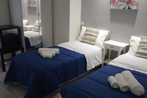 Classic Twin Room, 2 Twin Beds, Private Bathroom, City View | Minibar, in-room safe, desk, iron/ironing board