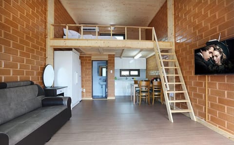 Traditional Duplex (Cypress and Red Clay Room) | Living area | Flat-screen TV