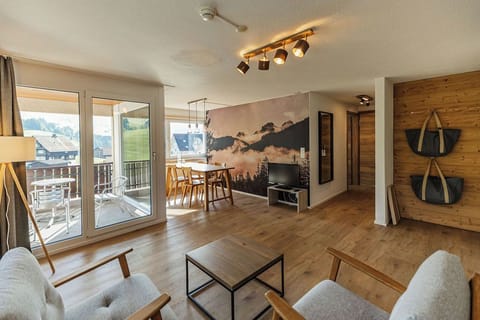 Suite (Roggenstock) | Living area | 50-inch flat-screen TV with cable channels, TV, foosball