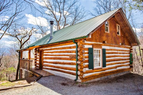 Real Pine log and chinked cabin at the top of the mountain with paved roads up