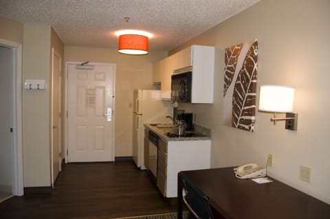 Suite, 1 Queen Bed | Private kitchenette | Full-size fridge, microwave, stovetop, dishwasher
