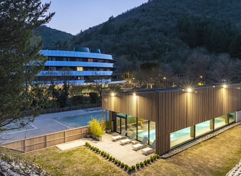 Indoor pool, seasonal outdoor pool, pool umbrellas, sun loungers
