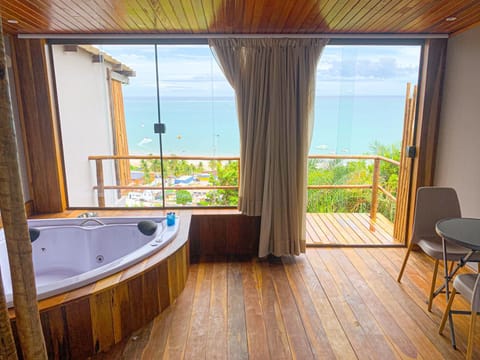 Deluxe Room, Sea View, Ground Floor | Minibar, blackout drapes, iron/ironing board, free WiFi