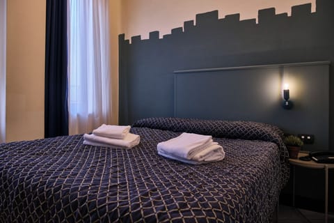 Family Quadruple Room | In-room safe, desk, laptop workspace, blackout drapes