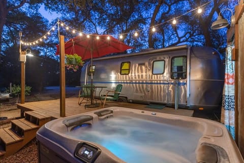 Our hot tub under the twinkle lights is super romantic.