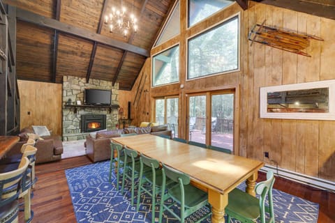 Dining in this room with exposed wood rafters and huge windows