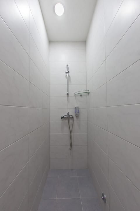 Classic Double Room (Orange) | Bathroom | Shower, free toiletries, hair dryer, slippers