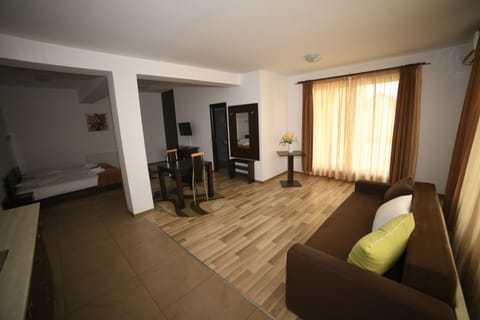 Family Suite | Living area | Flat-screen TV