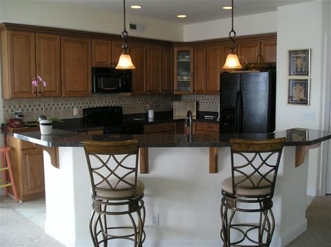 Upgraded kitchen, tiled backsplash, lighting on dimmers and upgraded appliances