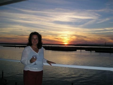 Beautiful May Sunset on private balcony and end unit at Sunset Bay Villas #219