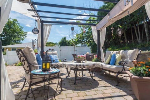 [Patio] Pergola with natural gas Zen fire table & river stream off to the left.