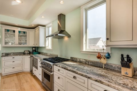 Cooking for a large group is easy in this home +chef can be part of the action