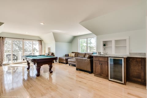 Wet bar and deck on the third floor offer space for everyone in your group