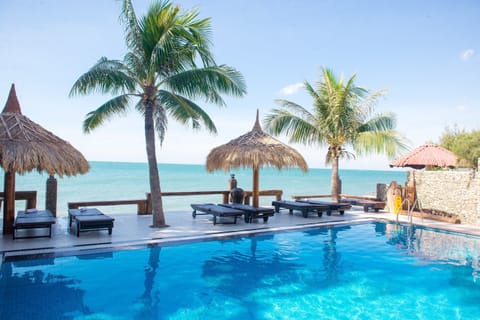 Outdoor pool, open 6:00 AM to 10:00 PM, pool umbrellas