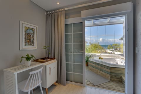 Deluxe Double Room, Beach View, Beachfront | Minibar, individually decorated, individually furnished, soundproofing