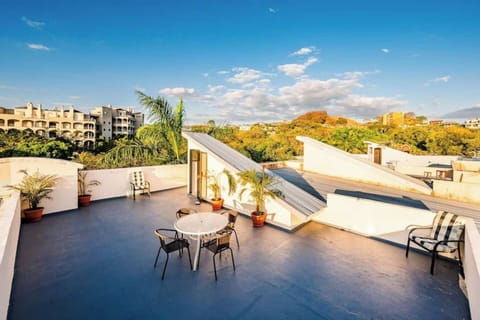 Private rooftop terrace with partial ocean views at this heart of Tamarindo vacation rental. Comfortable lounge seating, tropical breezes, and sunset views over town. Perfect for morning coffee, evening cocktails, or stargazing after beach days.
