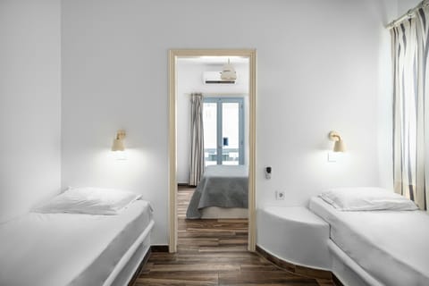 Two Bedroom Family Room with Street View | In-room safe, desk, iron/ironing board, free WiFi