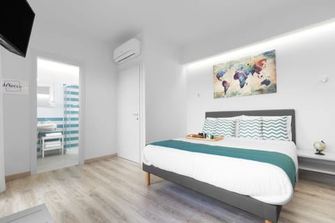 Deluxe Double Room, Terrace, Sea View | Minibar, in-room safe, desk, laptop workspace