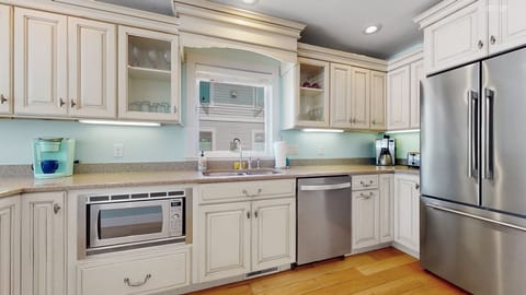 Brand-new (2023) high-end stainless steel kitchen appliances in kitchen