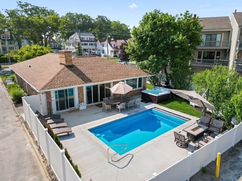 Brand new pool, hot tub, fire pit and backyard area right next to the beach!  