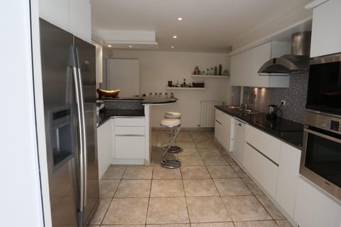 Th kitchen as seen from the indoor dining area