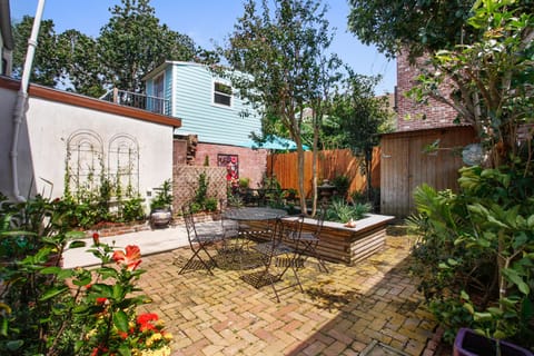 Courtyard Oasis, with table for 4 and a table for 6 in back.