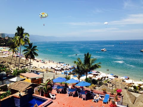 View of the pool deck, the beach and the Bay from the balcony.