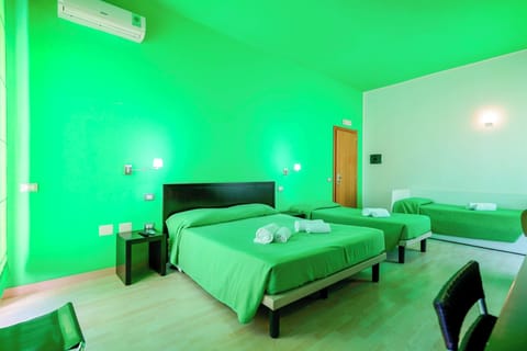 Family Double or Twin Room, Garden View, Garden Area | Minibar, in-room safe, desk, laptop workspace